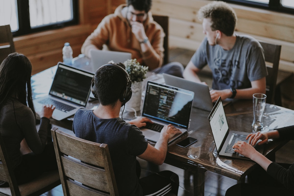 Young professionals collaborating in a tech workspace